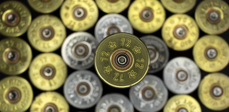 Selective focus on macro top view of a fired hunting cartridge Stock Photos