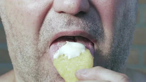 Selective focus. Man eats chicken nuggets harmful and tasty fast food. Stock-Footage 137060002