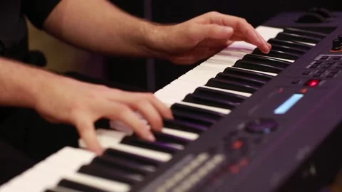 Selective focus to man keyboard player fingers. There are musical instrument for Stock Footage 138940049