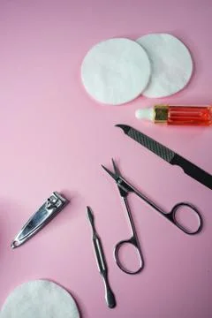Selective focus, manicure set on pink background, copyspace Stock Photos