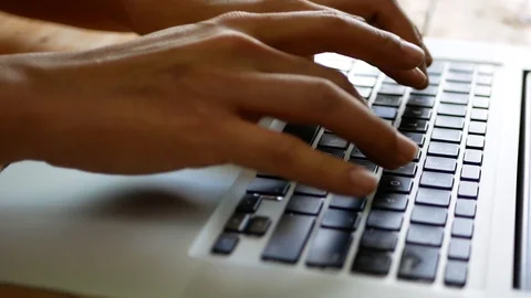 Selective focus of a man's hands typing / working on a keyboard of a computer Stock Footage 103492648