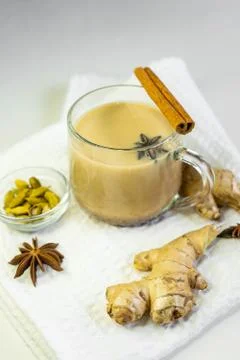 Selective focus, masala tea on white background with cinnamon and ginger spic Foto stock