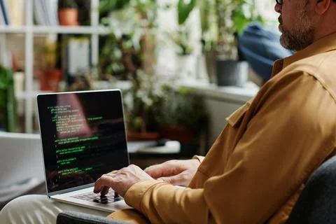 Selective focus on mature IT support engineer decoding data Stock Photos
