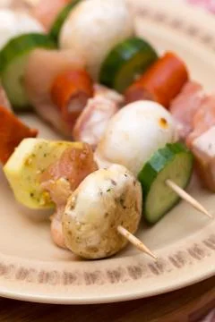 Selective focus on meat and vegetables on kebab Stock Photos