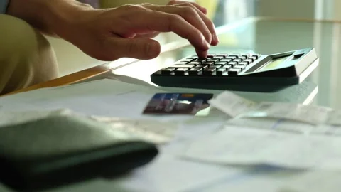 Selective focus at men hand using calculator. While calculate for bill. Video stock 146364085