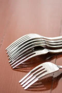 Selective focus on the metal fork with blurred background Stock Photos