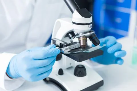 Selective focus of microscope being in use Stock Photos