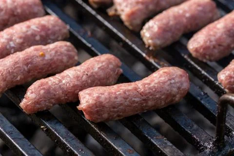 Selective focus on minced meat kebabs on the barbecue grill Stock Photos