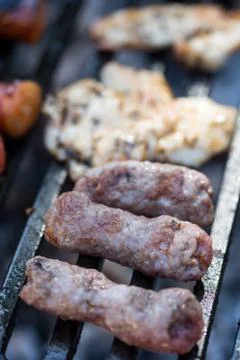 Selective focus on minced meat kebabs on the barbecue grill Stock Photos