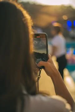 Selective focus on modern cellular phone using for clicking pictures via camera Stock Photos