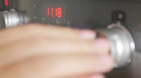 Selective focus on  modern oven  buttons while programing for cooking 4K 2160 Video stock 50211344