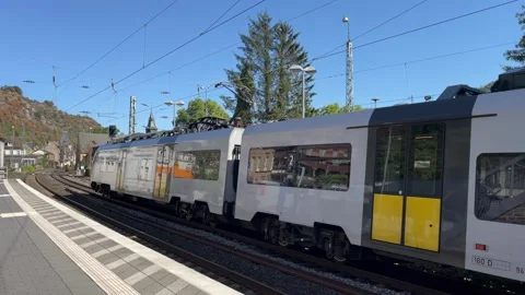 Selective focus modern train standing at the station platform Stock Footage 344954437