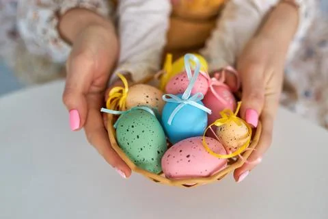 Selective focus on multicolor and design Easter Eggs on the hand Stock Photos