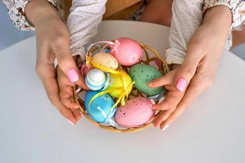 Selective focus on multicolor and design Easter Eggs on the hand Stock Photos