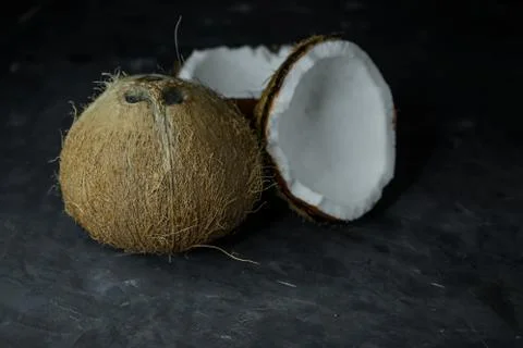 Selective focus, natural coconut on dark background Stock Photos
