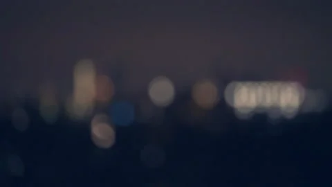 Selective focus in night city. Abstract blurred bokeh light in city Stock Footage 296686065
