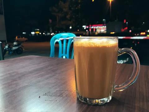 Selective focus with noise effect of tea with milk or popularly known as Teh Stock Photos