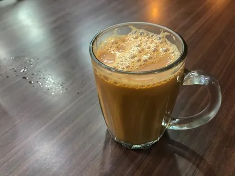 Selective focus with noise effect of tea with milk or popularly known as Teh Stock Photos