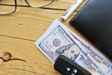 Selective focus of notebook, spectacle, smart phone, car key and american state  Stock Photos