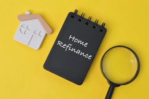 Selective focus of notebook written with text HOME REFINANCE. Stock Photos