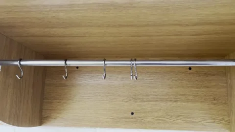 Selective focus on office wardrobe system with clothing hanging rod Stock Footage 313713929