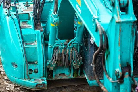 Selective focus to old blue bulldozer is stationary waiting to be repaired. Stock Photos