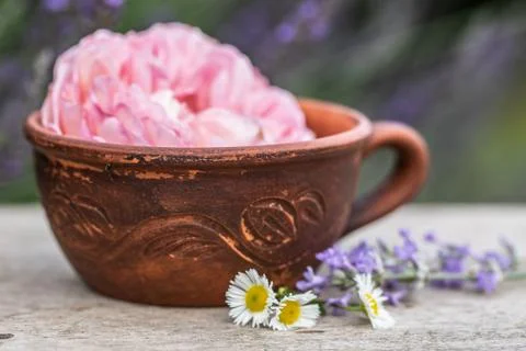 Selective focus old vintage ceramic cup of tea with flowers. Old rustic woode Stock Photos