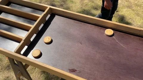 A selective focus of an old wooden game on the outside Stock Footage 199534431