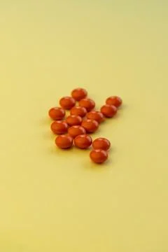 Selective focus, orange round tablets Stock Photos