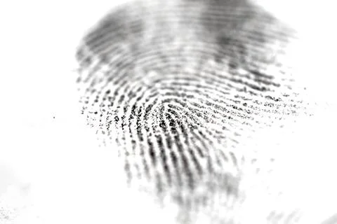 Selective focus of a paper impression of a fingerprint on a white background Foto stock