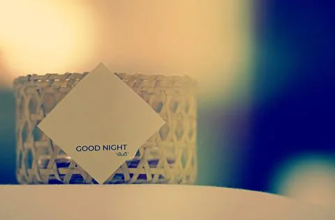 Selective focus on the paper with note and word "goodnight" Stock Photos