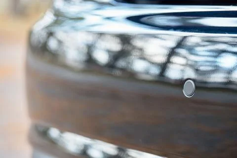 Selective focus on parking sensor of parking assistent system at rear of luxu Stock Photos