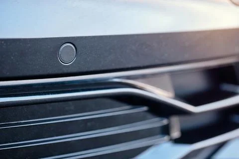 Selective focus on parking sensor of parking assistent system at front of lux Stock Photos