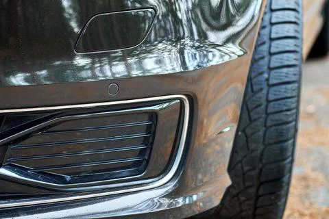 Selective focus on parking sensor of parking assistent system at front bumper of Stock Photos