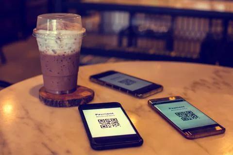 Selective  focus to payment QR code tag on smartphone with cold  cocoa drink  Stock Photos