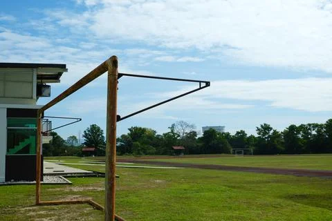 Selective focus picture of rusty and useless goalpost been put aside for fiel Stock Photos