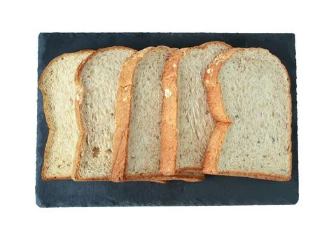 Selective focus of pile of toasted bread slices on a single black plate. On p Stock Photos