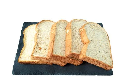 Selective focus of pile of toasted bread slices on a single black plate. On p Stock Photos