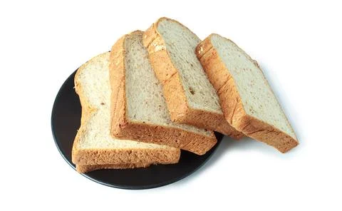 Selective focus of pile of toasted bread slices on a single black plate. On p Stock Photos