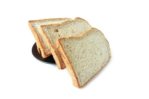 Selective focus of pile of toasted bread slices on a single black plate. On p Stock Photos