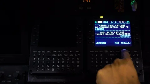 Selective focus of a pilot hand pressing button of flight management computer Stock Footage 108537257