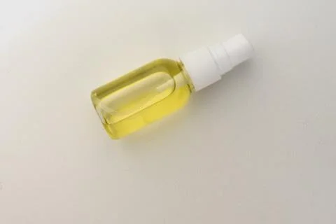 Selective focus, plastic spray jar with cosmetic oil Stock Photos