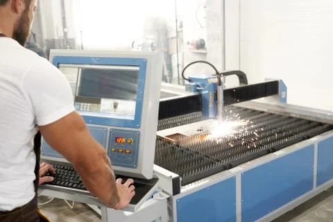 Selective focus of process of plasma cutting on factory Stock Photos