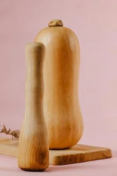Selective focus of Pumpkin with spices on orange prepared to puree with morta Stock Photos