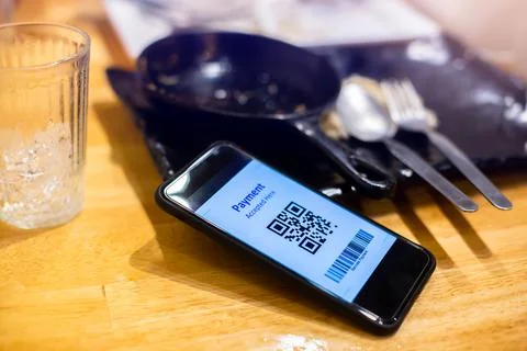 Selective focus to QR code payment and Barcode on smart phone. Stock Photos