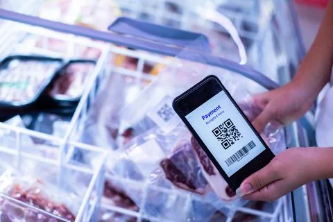 Selective focus to QR code tag on smartphone with blurry  frozen food at supe Stock Photos
