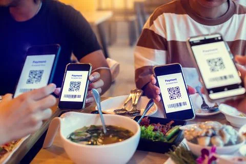 Selective focus to QR code tag and Barcode on smartphone in hands with blurry Stock Photos