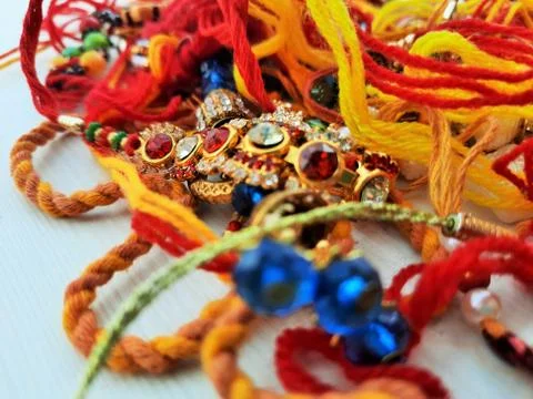 Selective focus on Rakhee or holy thread on Indian festival Raksha Bandhan Stock Photos