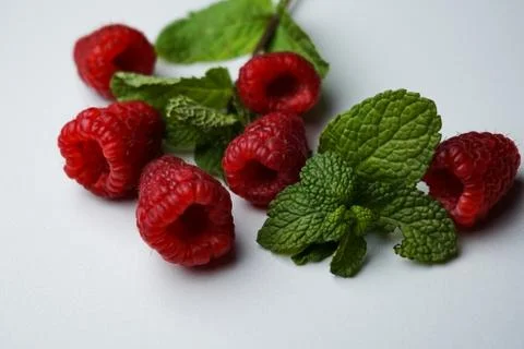 Selective focus, raspberry berries with mint, macro Stock Photos