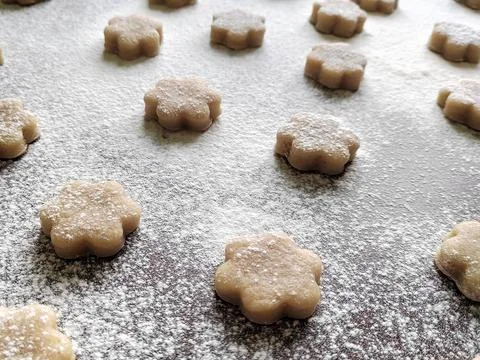 Selective focus on raw cookies on brown table Stock Photos